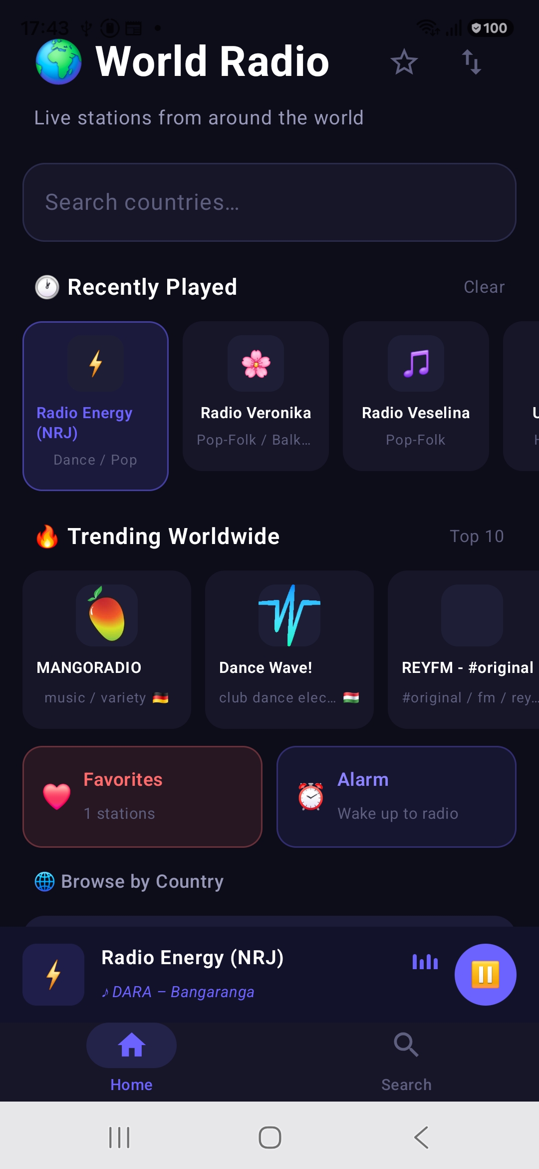 World Radio home screen with Recently Played, Trending Worldwide, Favorites and Alarm shortcuts and the mini player